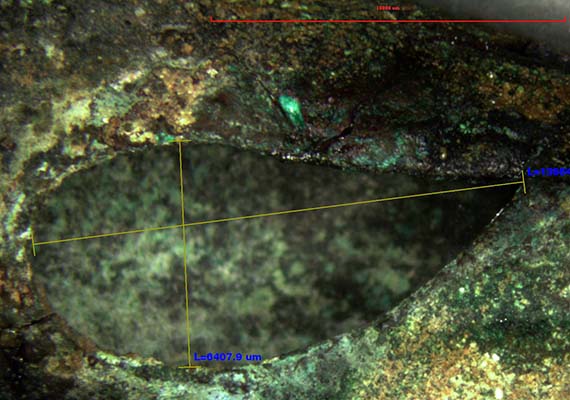 Image from digital microscope showing measurements of tear-shaped sound hole