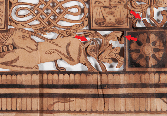 Detail of areas with broken and folded pieces on Judaica papercut