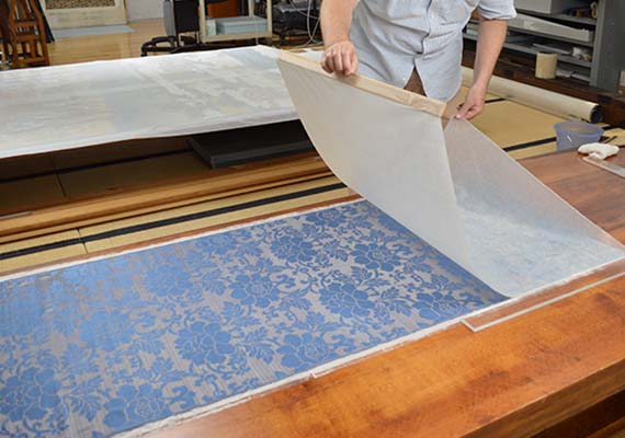 conservator lining silk with Japanese paper