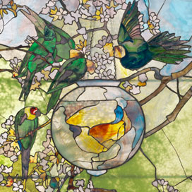 Detail of stained glass depicting four green birds on tree branches