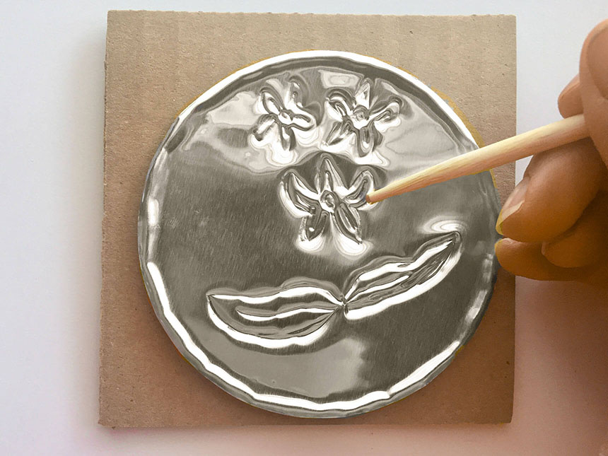 Leaves drawn on the foil using wooden stylus