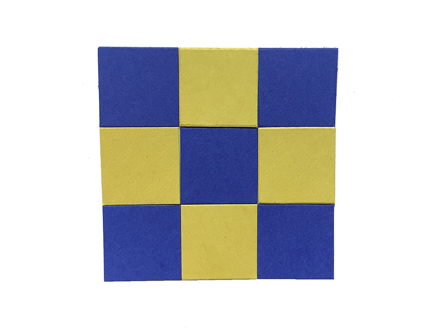 pattern of nine squares alternating in color between blue and yellow, arranged in 3x3 grid