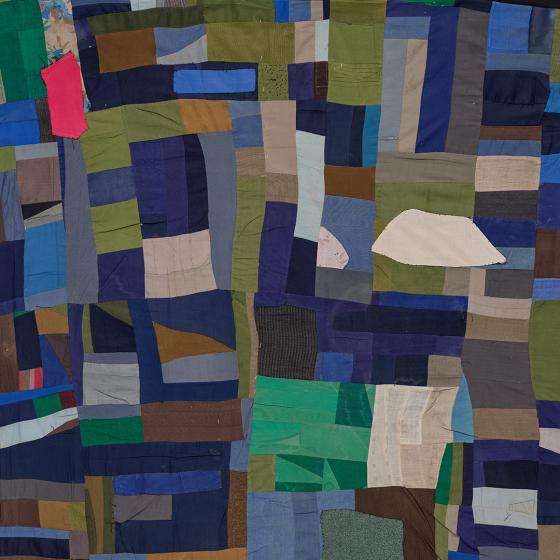 Irregularly shaped scraps of fabric placed near each other to form an abstract colorful composition.