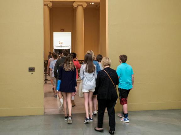 Students walking out of Egyptian gallery into Sargent rotunda