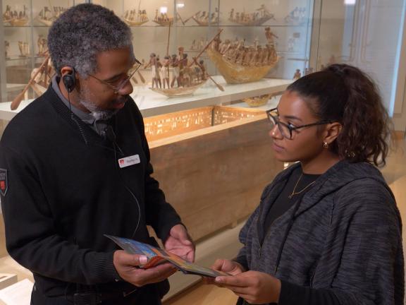 Security guard shows visitor their location on map
