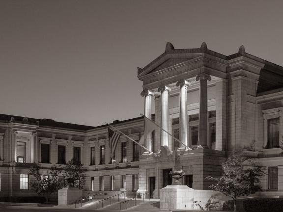 Black and white photograph of the Museum's Huntington facade in the evening