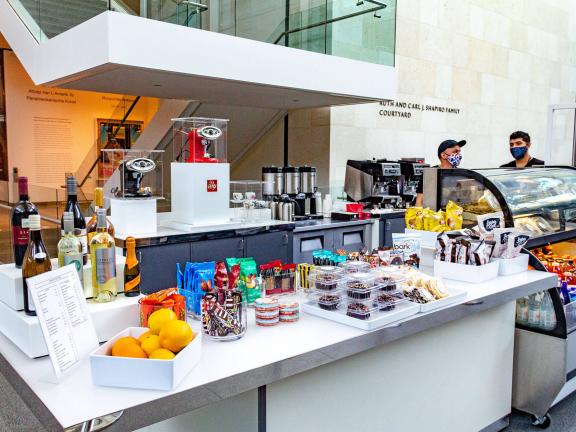 Counter with an arrangement of packaged foods at kiosk in Shapiro Family Courtyard