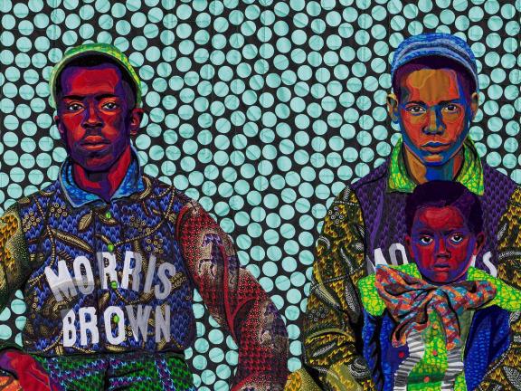 Detail of quilt showing three college-age baseball players wearing uniforms