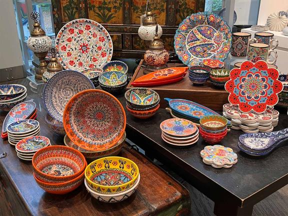 An assortment of colorful dishes in the MFA shop.