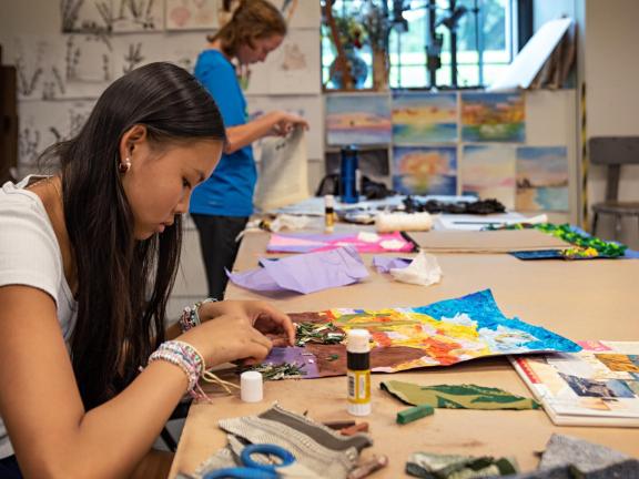 Teen student works on mixed media in classroom (SAC)