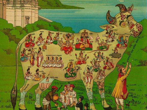 A cow in a bright green pasture.  The cow has small people placed across different parts of its body.