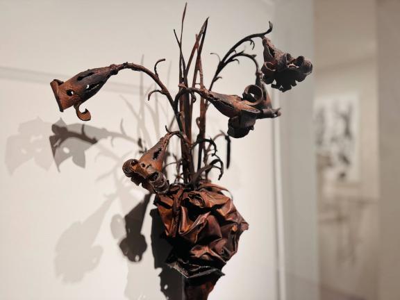 Metal sculpture of wilting flower arrangement
