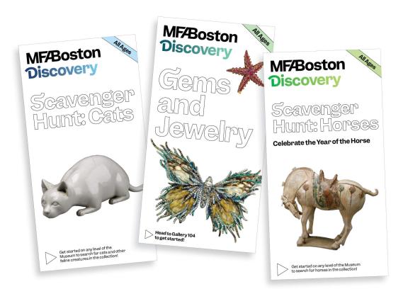 Splay of Discovery Guide pamphlets featuring activities for kids, such as scavenger hunts
