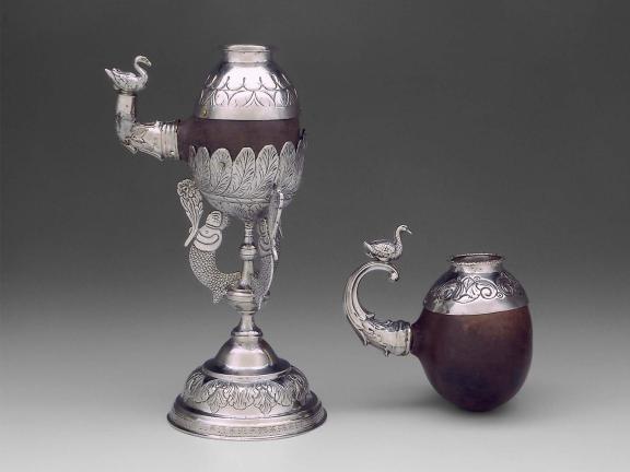 An elaborate cup made of silver and nutshell.