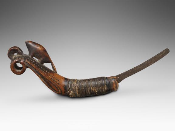 A knife with a wooden handle that resembles a beaver.