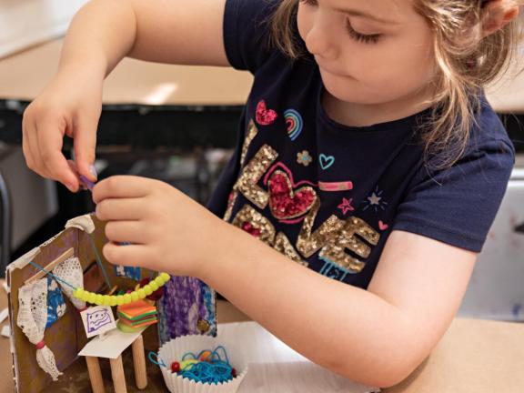 Young girl creates miniature room