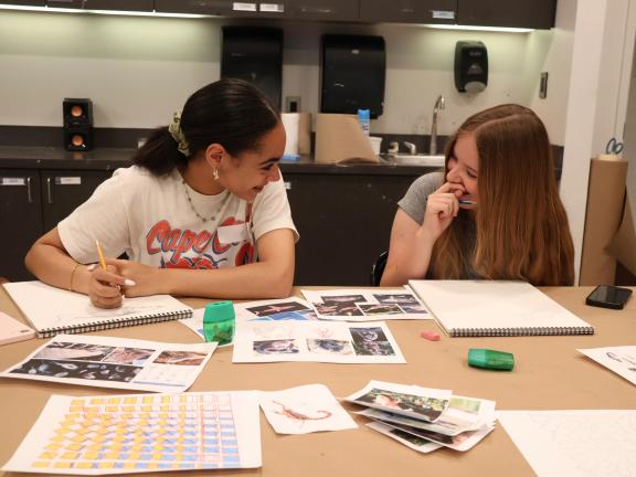 Two female teen students in art class (SAC)