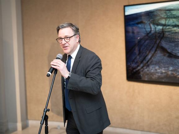 Museum director Pierre Terjanian speaking at microphone