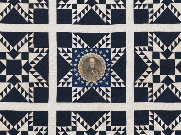 detail of star-patterned quilt with portrait of Henry Clay at center