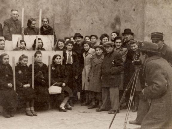 Photograph of Henryk Ross photographing for identification cards