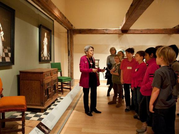 Gallery instructor speaking to school group in Manning House gallery, LG35
