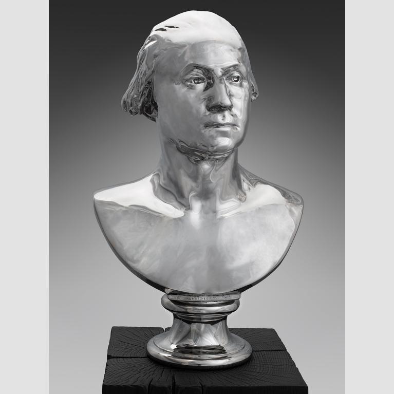 A metallic bust of George Washington.