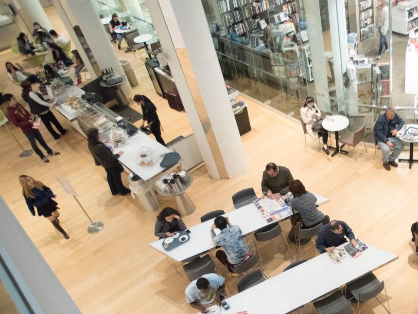 Overhead view of Taste dining venue, with visitors eating and talking at tables and ordering food at the counter