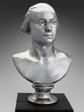 A metallic bust of George Washington.