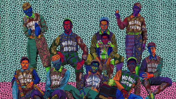 detail of brightly colored quilt depicting a group of young baseball players in uniform