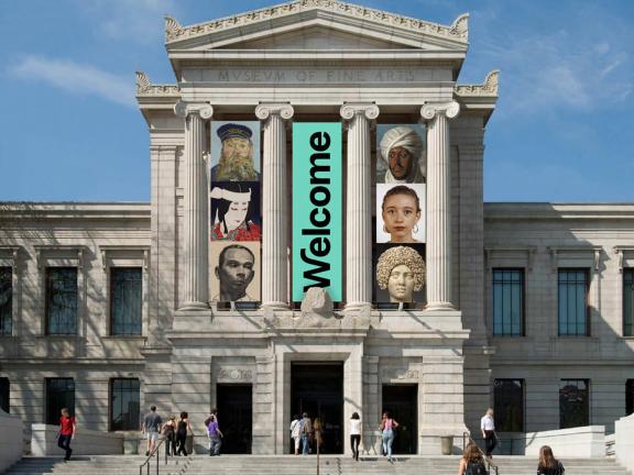 Facade of the Museum's Huntington Avenue entrance, with three vertical banners, the center one with the word "Welcome" on it, flanked by banners each depicting details of various portraits