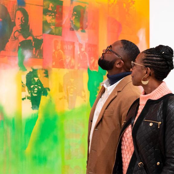 Two visitors look at Frank Bowling's "Middle Passage."