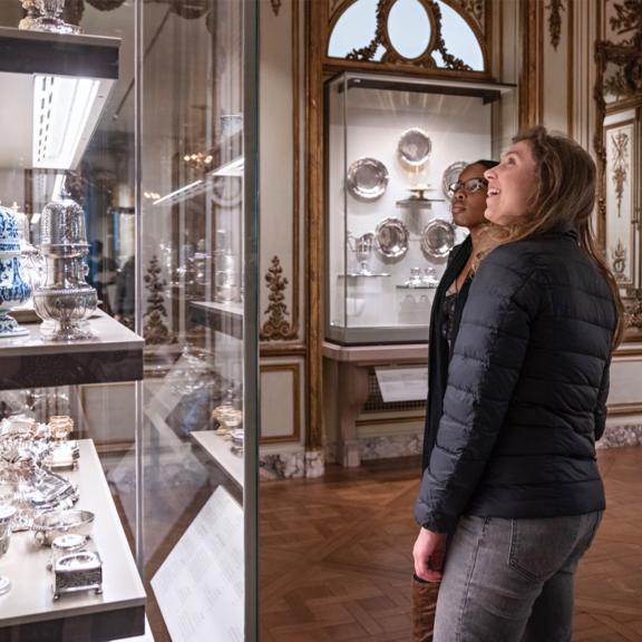 Two visitors explore the French Salon gallery.