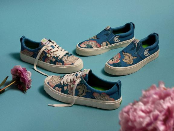 Two pairs of shoes with pink flowers