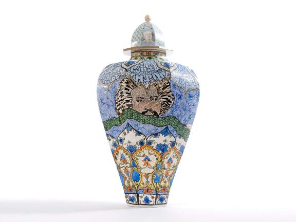 ceramic vase made of mosaic of small tile pieces, depicting portrait of Frederick Douglass as well as various words in the style of street art