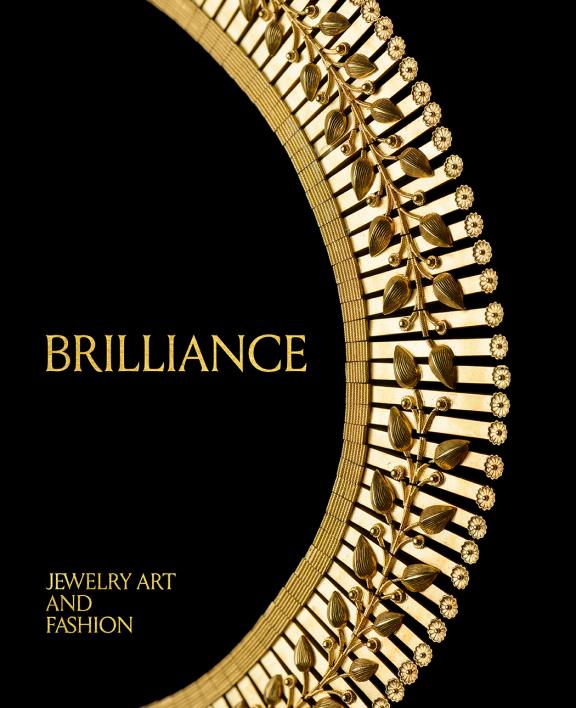 Image of book cover featuring a gold necklace with a floral design on a black background
