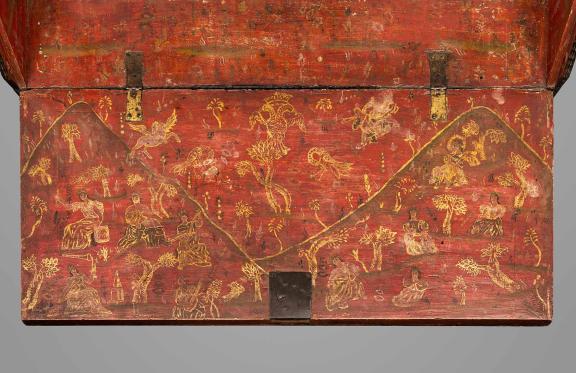 A desk surface painted orange with a detailed map painted over the surface in gold.