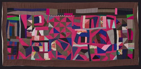 Irregularly shaped scraps of fabric placed near each other to form an abstract colorful composition.