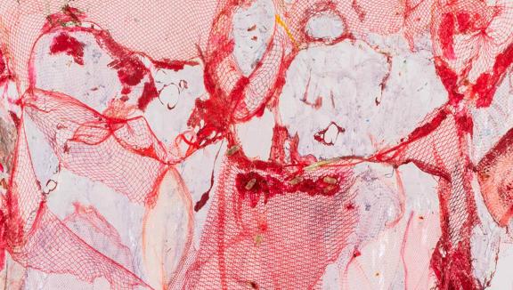 An abstract pink composition with veins of red.