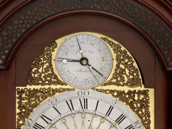 Elaborately decorated face of a clock.