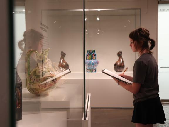 Female teen student draws vessel in gallery (SAC)