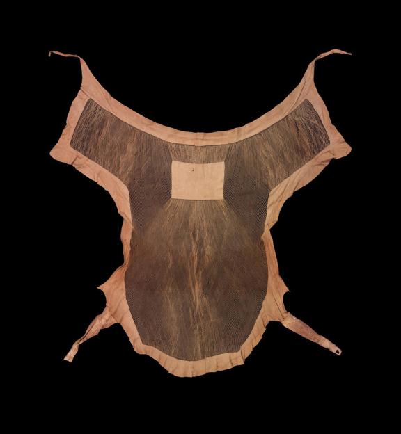 A loincloth made of tanned goatskin splayed open.