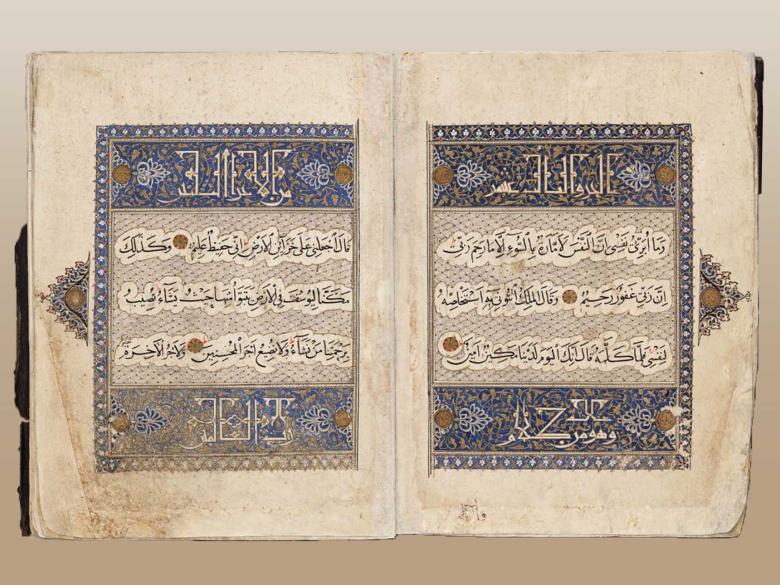 open pages of qu'ran with calligraphy