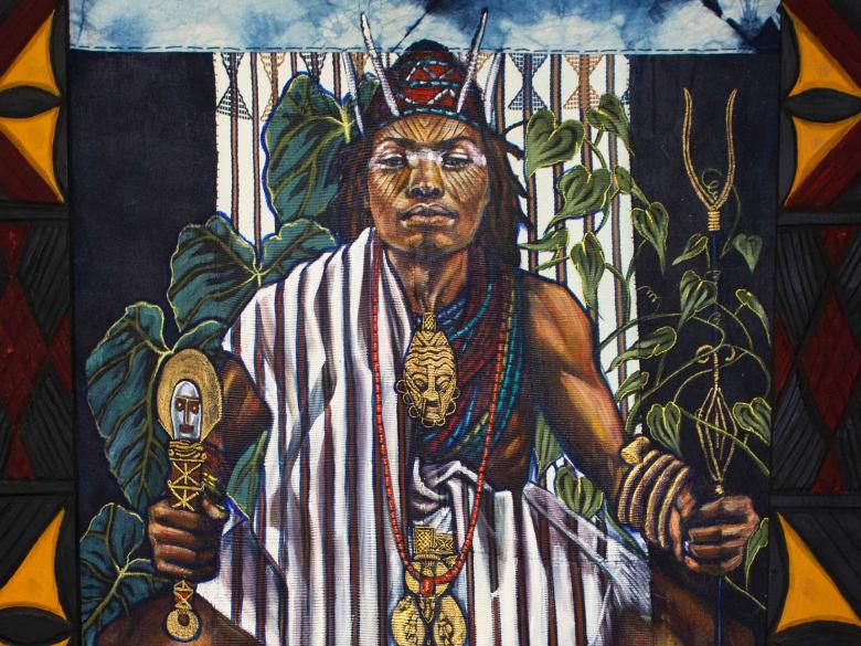 Detail of painting and textile on wood; an enthroned male figure faces out, wears black-and-white striped garment. Green plants around with emblems of Eze Nri