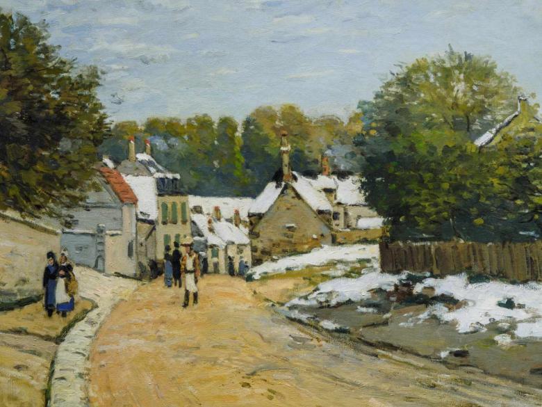 A dirt road leads to a quaint village surrounded by trees with light snow cover.