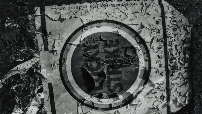 A decaying cardboard box of cigarettes with "LUCKY STRIKE" in bold graphic letters inside a circle.
