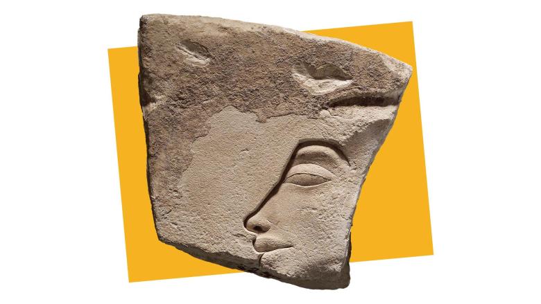 Limestone shard of a relief depicting part of a pharaoh's face in profile, in front of a yellow square.